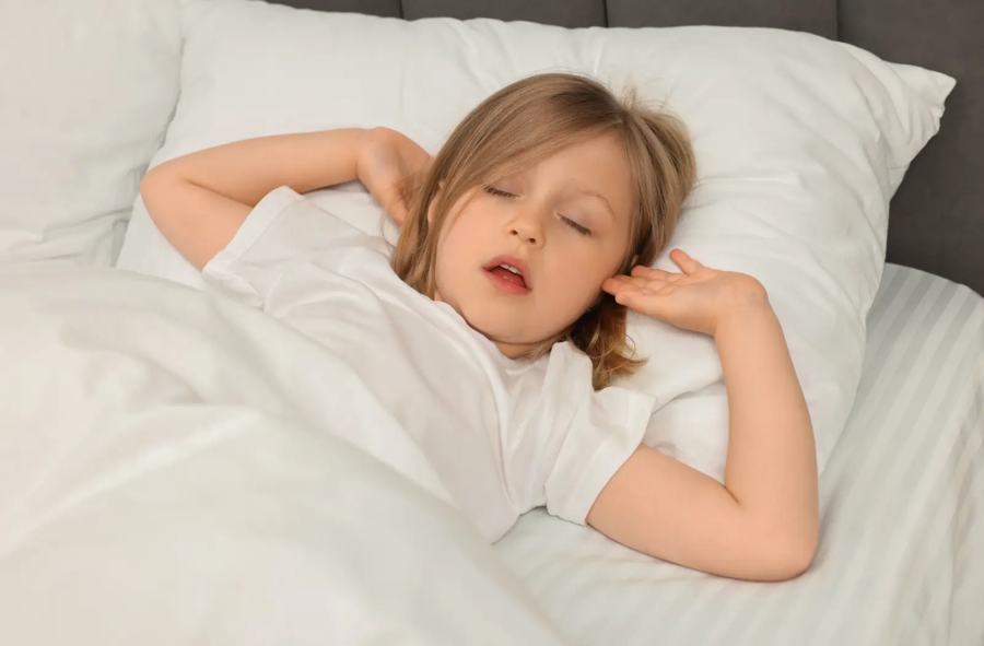 A child asleep in bed